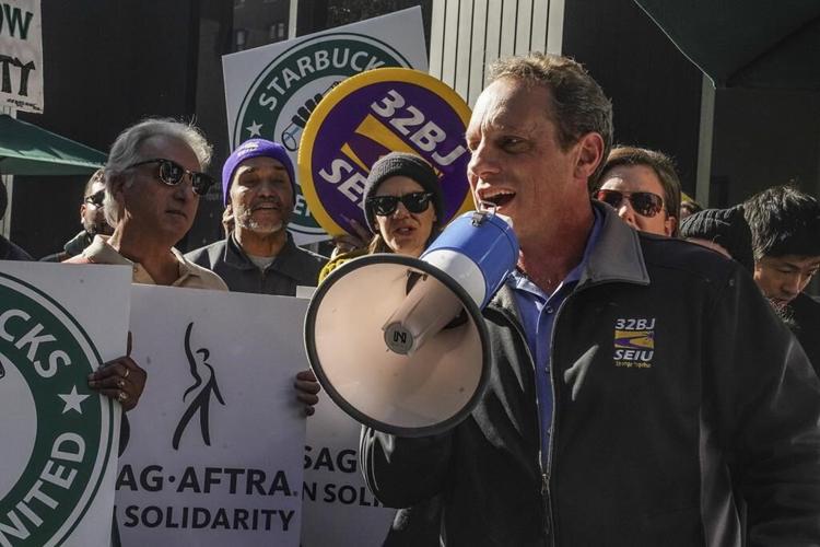 Thousands of Starbucks workers go on a one-day strike, one of busiest days of year for the chain