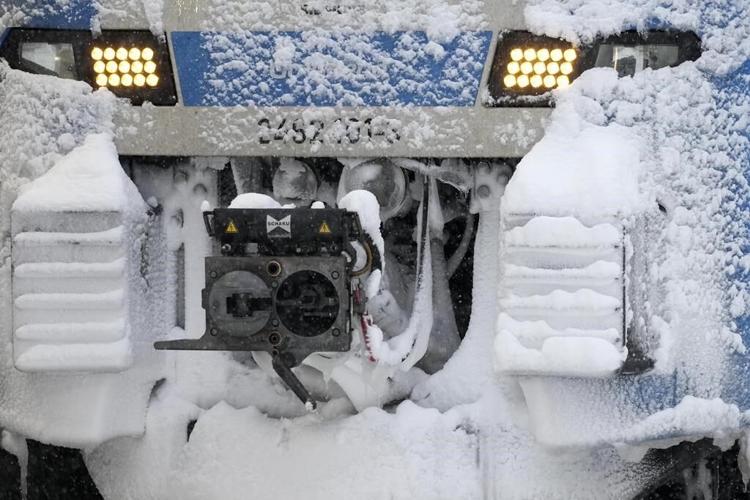 A snowstorm brings Munich airport to a standstill and causes travel chaos in central Europe
