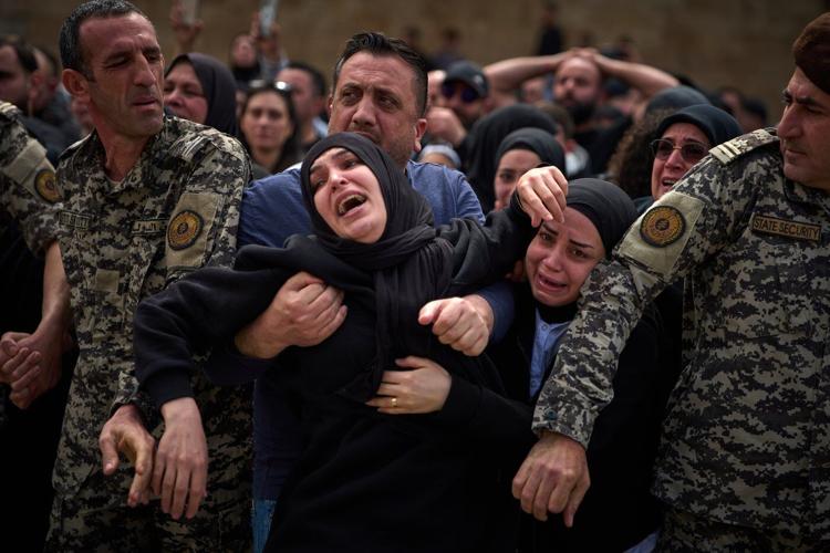 Lebanese bury 13 officers killed by Israel as grief and rage surge ahead of talks in the US