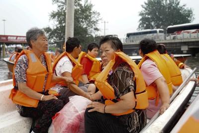 Highway bridge in northern China collapses due to flash floods and casualties are unknown