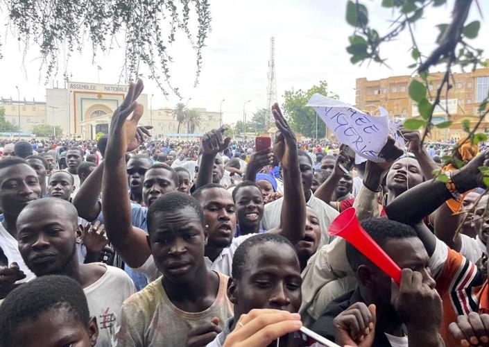 Supporters of Niger's coup march through the capital waving Russian flags and denouncing France