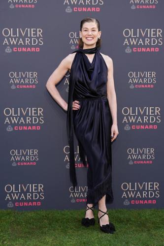 Rosamund Pike wins best actress and Paddington Bear gets best set design at London's Olivier Awards
