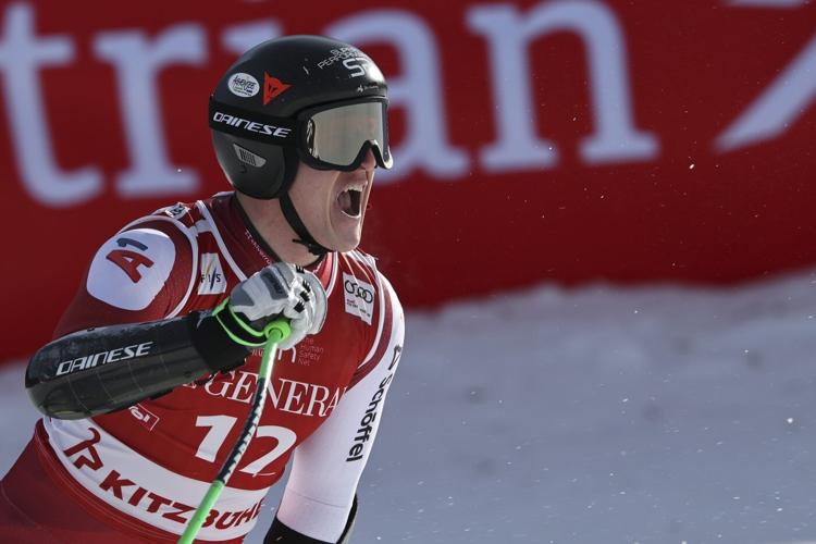 Swiss skier Marco Odermatt takes eventful World Cup super-G for 1st win in Kitzbuehel