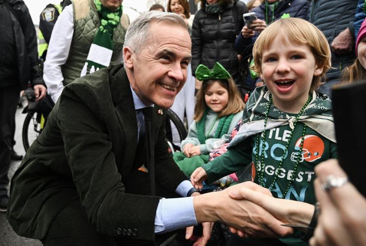 Prime Minister Mark Carney marches in Montreal's St. Patrick's Day parade celebration