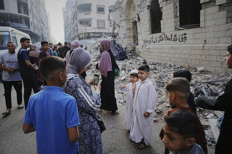 Gaza marks the start of Eid with outdoor prayers amongst the rubble and food growing ever scarcer