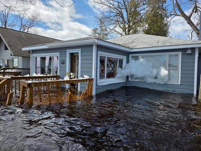 Heavy rain and snowmelt are hurtling large chunks of ice into northeastern Michigan homes