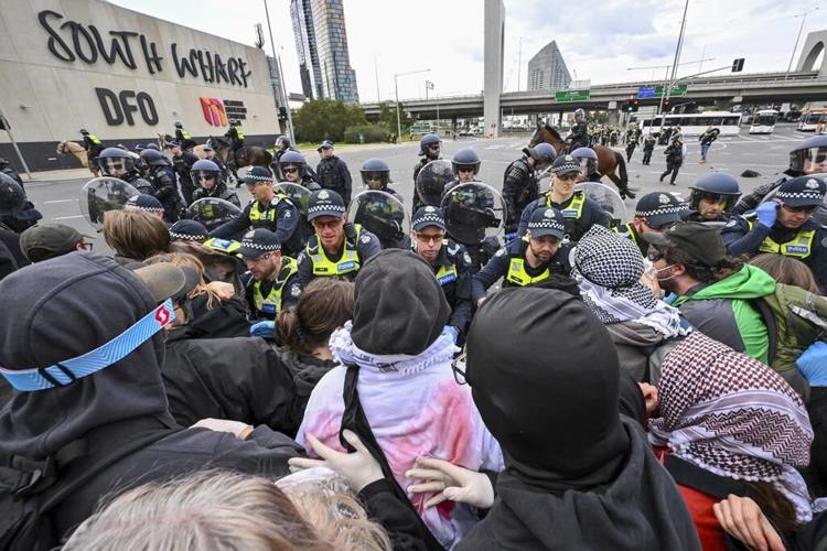 Anti-war protesters clash with police outside Australian arms convention