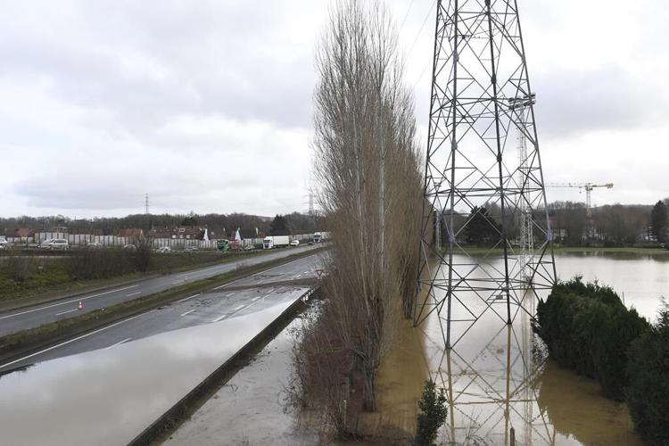 Extreme cold leaves thousands without power in Nordic countries as floods persist in Germany