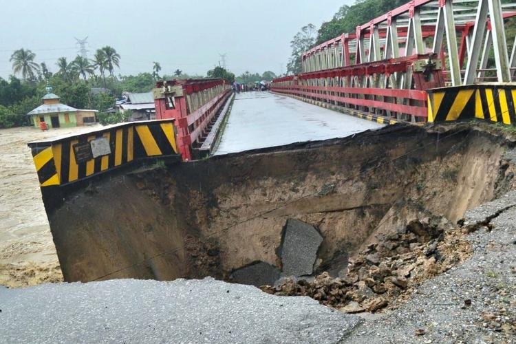 Landslides and flash floods on Indonesia’s Sumatra island leave at least 10 dead and 6 missing
