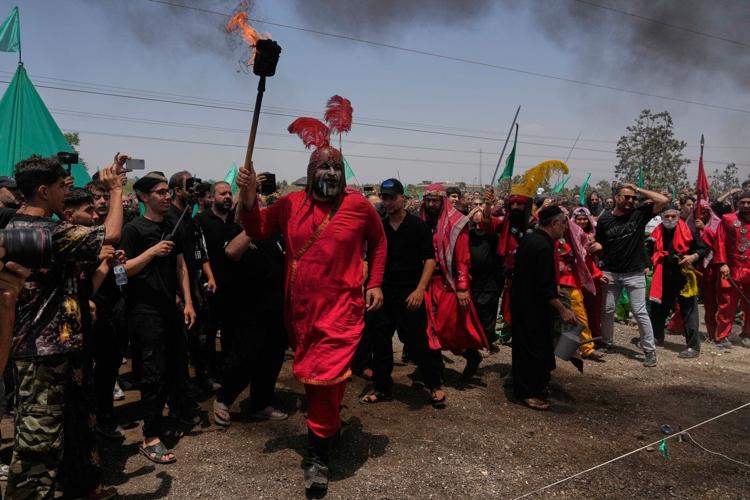 Photos show Ashoura commemorations shaped by war and loss in Lebanon and Iran