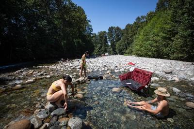 Rare May heat wave brings worries for further floods and wildfires