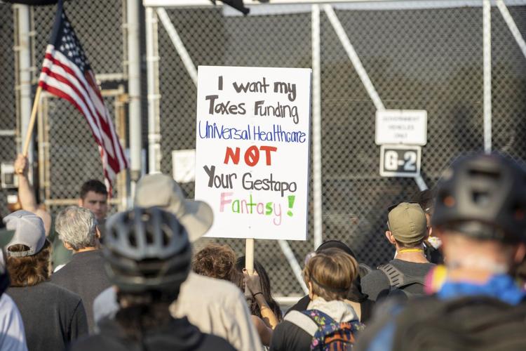 Protesters try to block vehicles at key immigration building in suburban Chicago