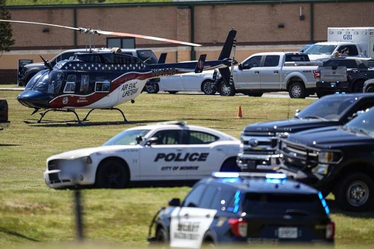 Shooter kills 4 at a Georgia high school and a suspect is in custody, officials say