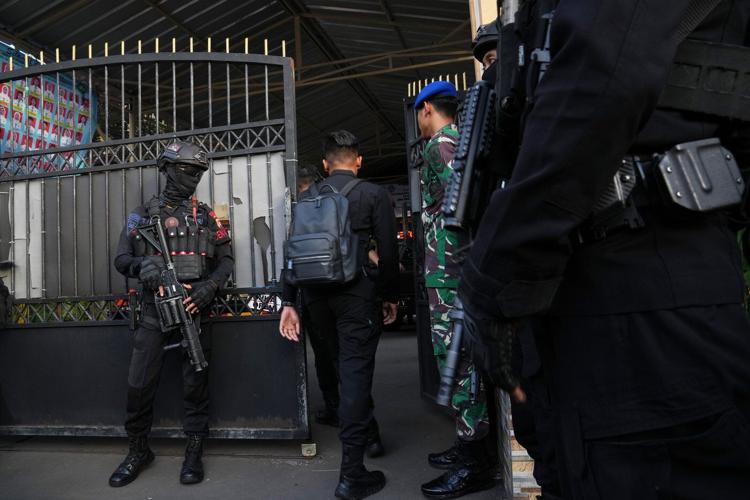 Multiple explosions shake a mosque in an Indonesian high school and injure 54