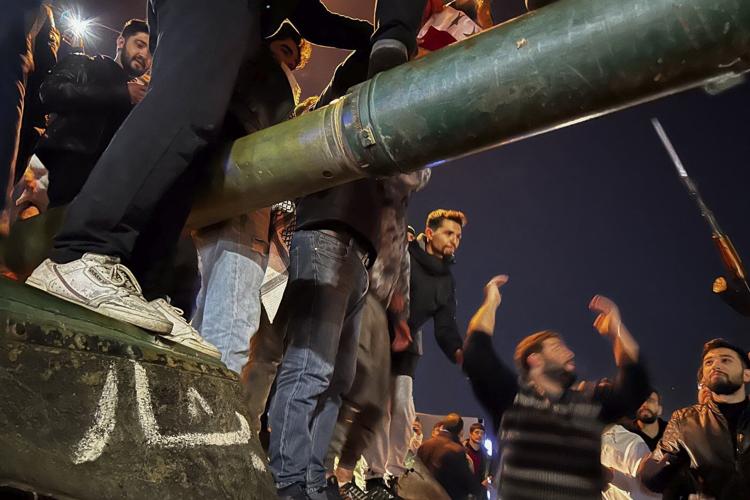 Syrian government falls to fast-moving rebels, ending 50 years of iron rule by the Assad family