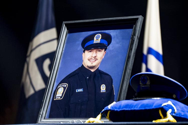 Police officers march in Montreal ahead of funeral for officer killed in shooting