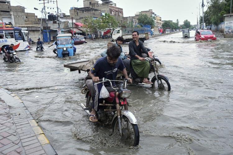 Pakistan restores electricity and reopens roads in areas where floods killed over 300