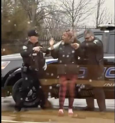 Officer who hit woman in McDonald's dispute placed on leave