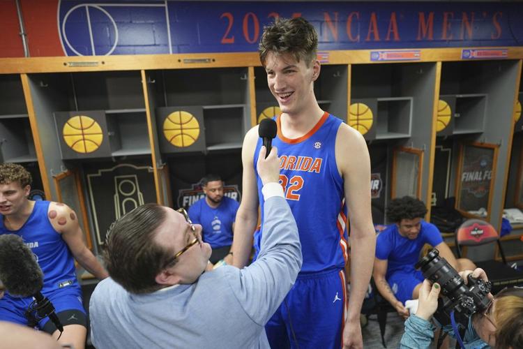 The world's tallest teen, 7-foot-9 centre Olivier Rioux, gives football a try at Florida
