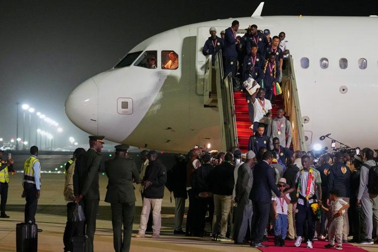 Senegal President greets team as triumphant players receive heroes welcome in Dakar