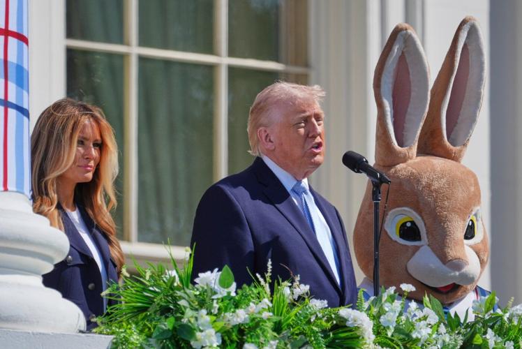 Photos of Trump's Monday, talking Iran at Easter Egg Roll and mimicking a sniper in the press room