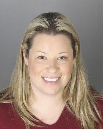 Pro-Trump attorney returns to Michigan to turn herself in on outstanding warrant