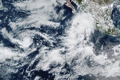 Lorena becomes a hurricane off the western coast of Mexico as Kiko travels over open waters