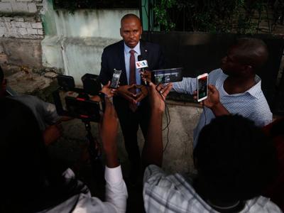 Haitian police arrest a former senator accused of working with gangs to attack a peaceful community