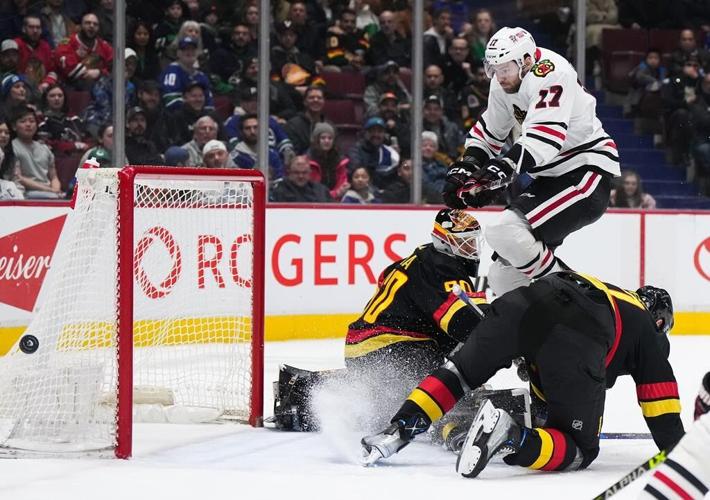 Canucks rally in third to beat Blackhawks 5-2 in Tocchet debut