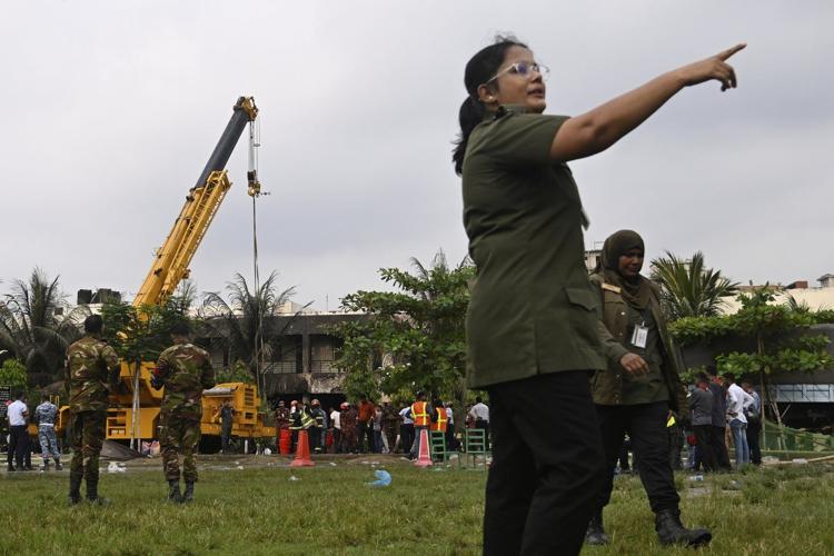 Photos show the aftermath after a training jet crashed into a school campus in Bangladesh