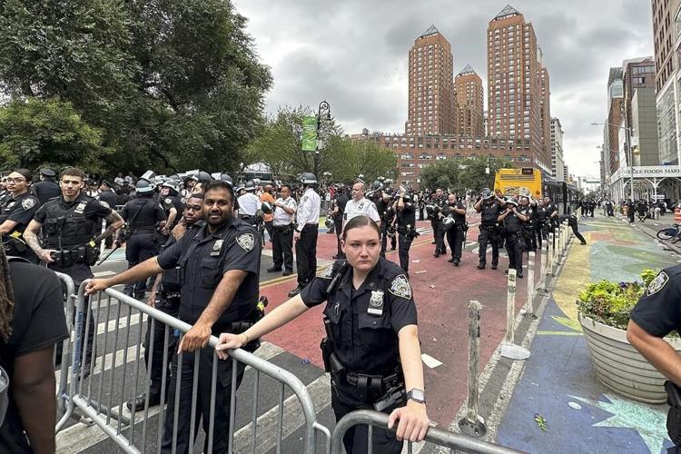 Crowd overwhelms New York City's Union Square, tosses chairs, climbs on vehicles