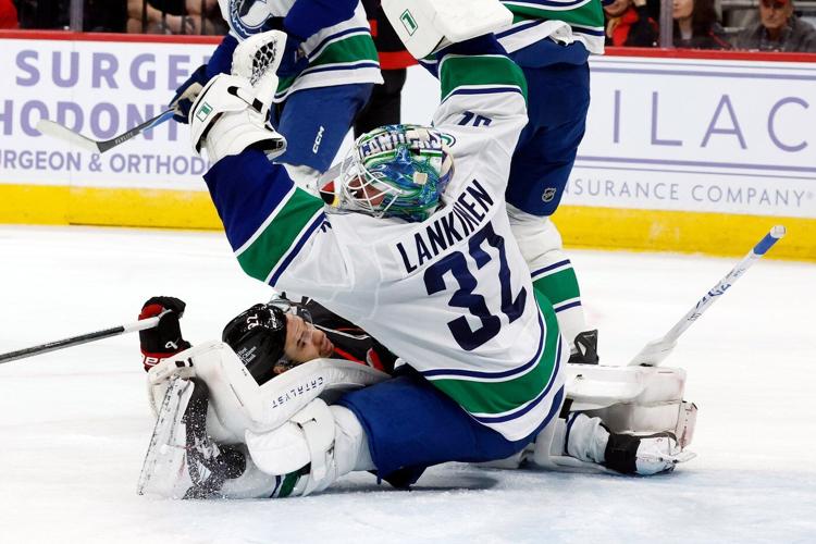 Aho scores in OT to lift Hurricanes to 4-3 win over Canucks