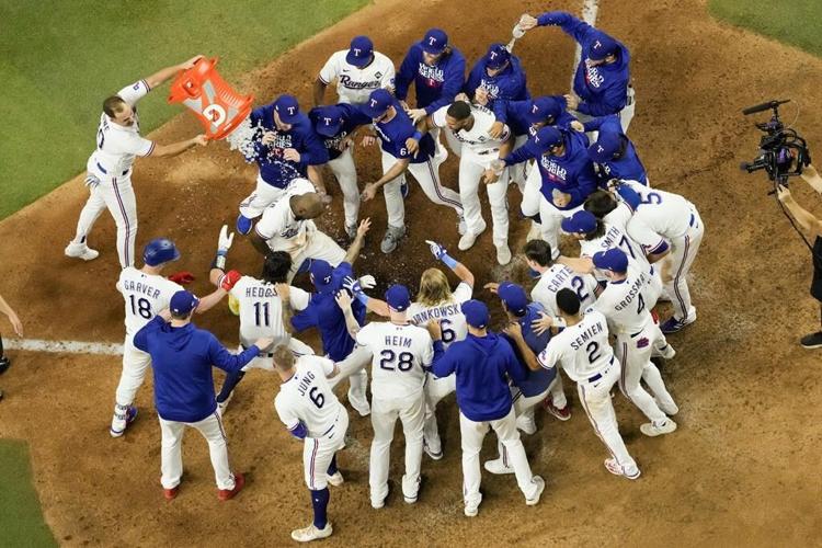 García's HR in 11th, Seager's tying shot in 9th rally Rangers past Arizona 6-5 in Series opener