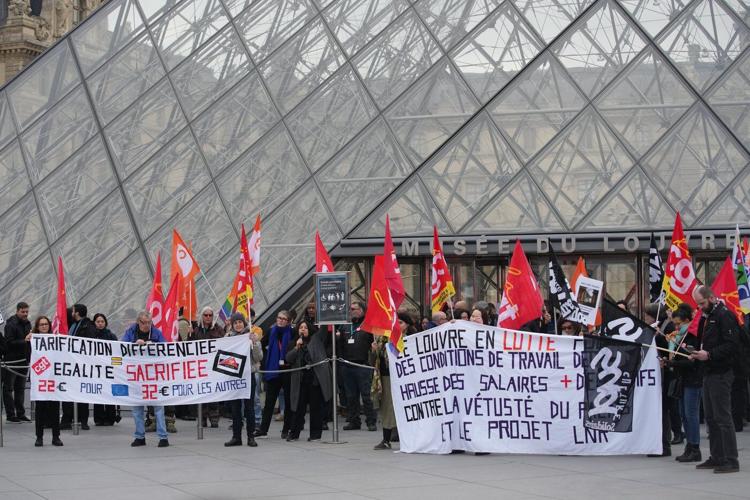 Louvre workers vote to extend a strike as the museum partially reopens