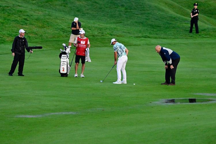 Scheffler makes clutch putt to force Monday playoff against Hovland in Travelers Championship