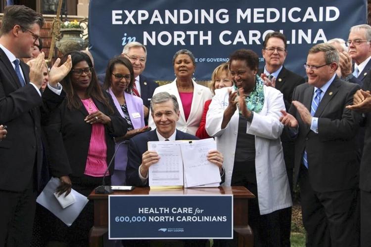 N. Carolina governor signs Medicaid expansion bill into law