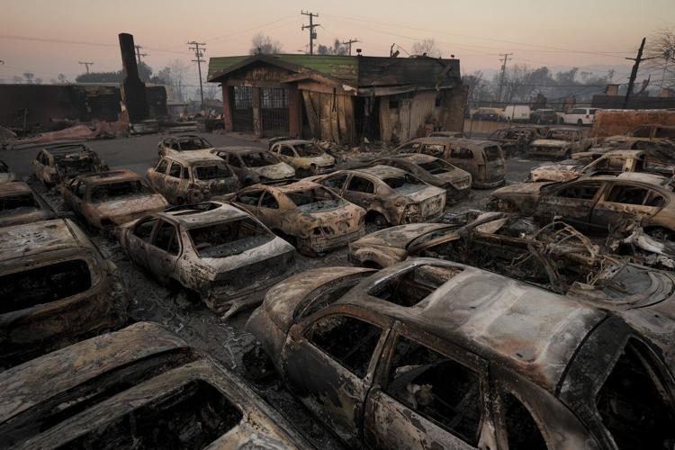 Families in shock begin to visit their charred homes in Los Angeles area