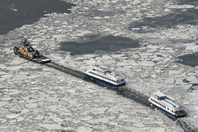 Bitter cold grips the eastern US as winter storm deaths rise and power outages linger
