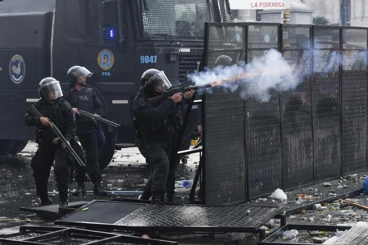 Argentine riot police disperse protesters with water cannons and tear gas ahead of key Senate vote