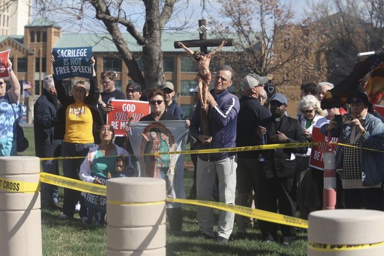 Satanist leader's attempt to hold Black Mass in Kansas Statehouse sparks chaos and 4 arrests