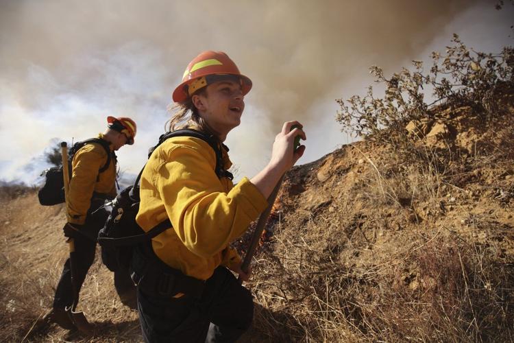 Firefighters battle to maintain the upper hand on a huge fire north of Los Angeles