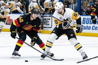 Surging Vancouver Canucks top struggling Pittsburgh Penguins 4-3