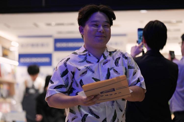 Fans mark the release of new Haruki Murakami novel at a midnight event in Tokyo
