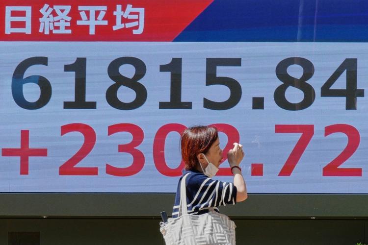 Hopes for reopening the Strait of Hormuz push Asian shares higher, as oil prices hold above $100