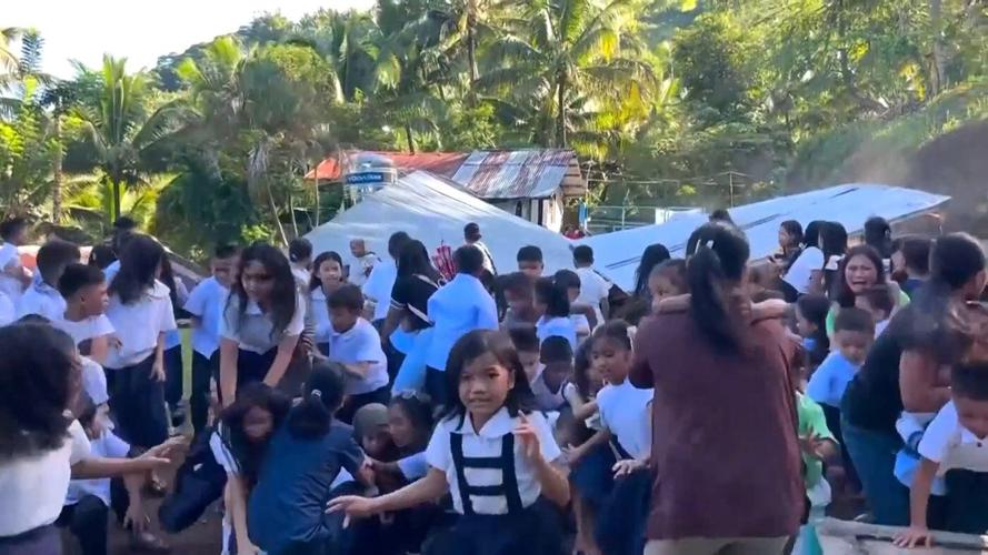 A 7.8 magnitude quake kills 12, destroys buildings and sparks tsunami in southern Philippines