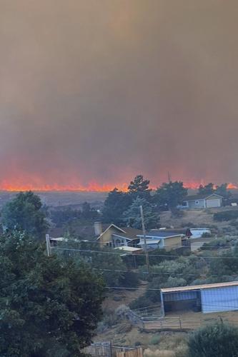 Firefighters are trying to stop a fast-moving Nevada wildfire from spreading to homes in Reno
