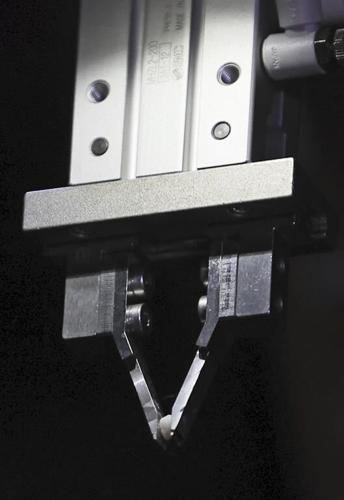 A tiny grain of nuclear fuel is pulled from ruined Japanese nuclear plant, in a step toward cleanup