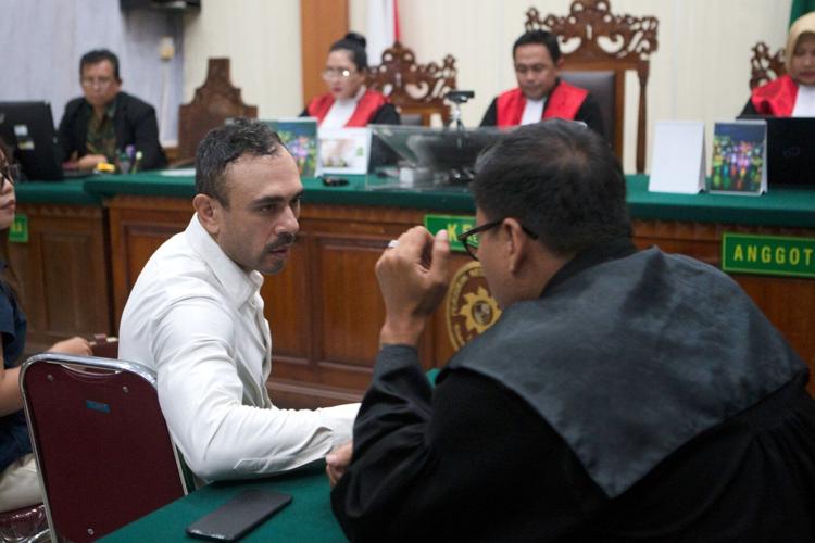 Indonesian court sentences an Australian to 12 years in prison for smuggling cocaine to Bali
