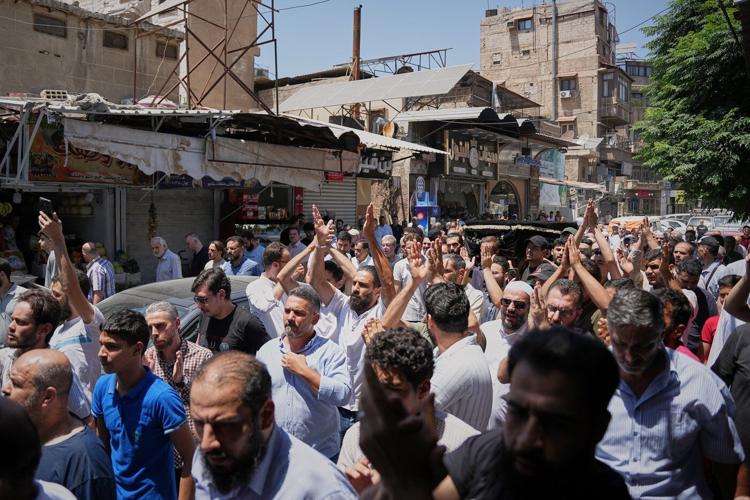 Mourners in Damascus bury cafe blast victims as officials promise justice