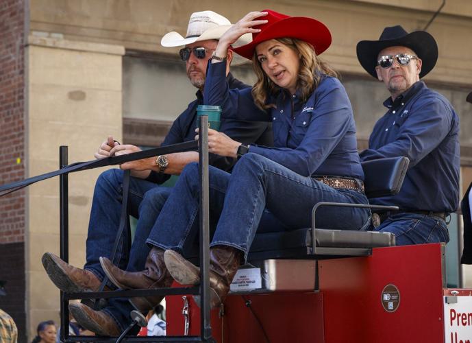 'You suuuuuck!': Smith gets cheers and jeers riding in Calgary Stampede parade